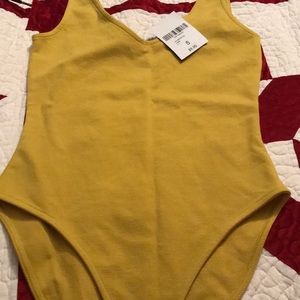 Brand new yellow body suit
